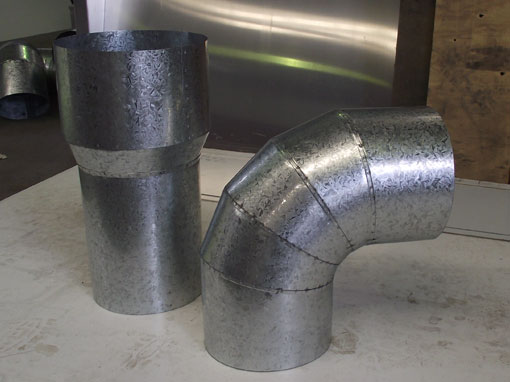 metal rainwater pipe elbow and funnel detail