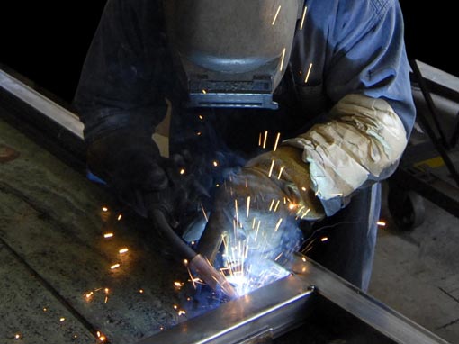 worker welding metal